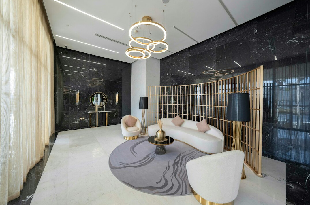 Bright modern office reception area with seating and plants